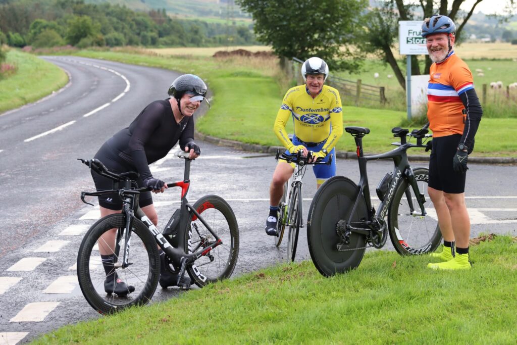 Three racers chatting after an FCA Midweek Time Trial event at Cleish